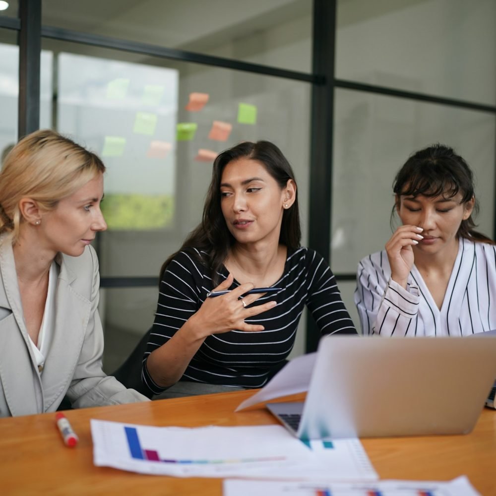 Coworkers Giving Speech Presenting New Idea To Colleagues In Office